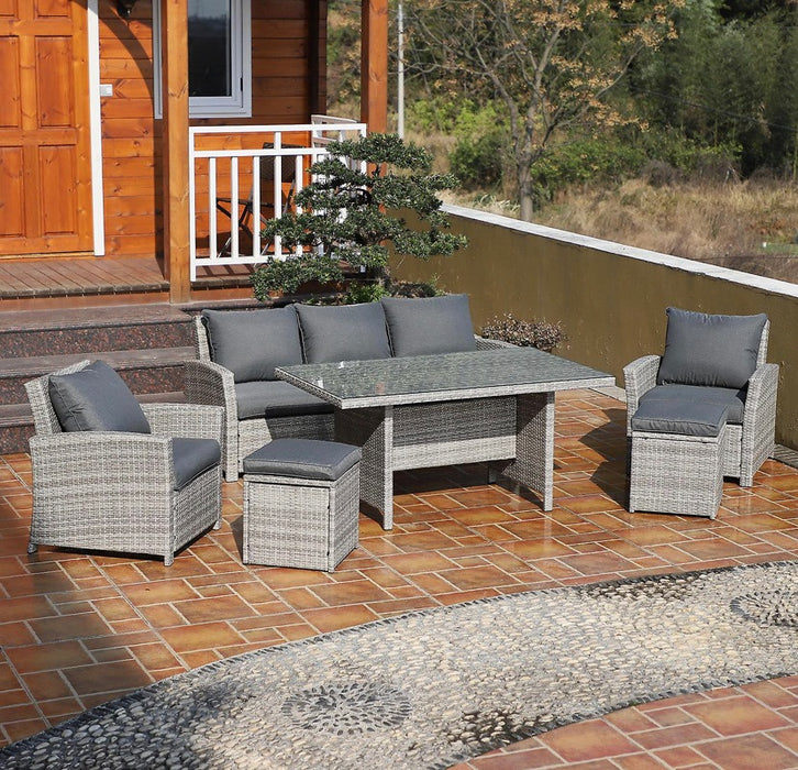 a lifestyle image of the 6 piece rattan garden dining set in grey from ramoche