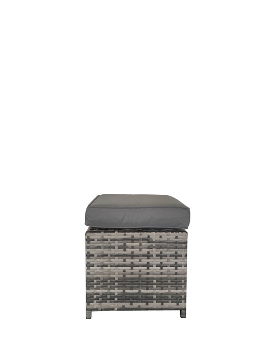 an ottoman stool with a padded grey cushion from the rattan dining set